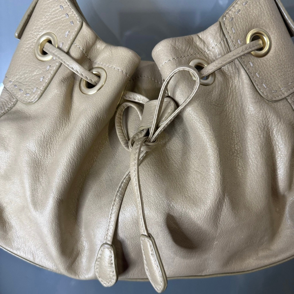 Cole Haan Metallic Beige Leather Drawstring Shoulder Bag - Picture 2 of 14